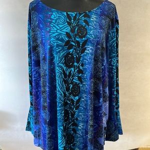 This is a Bob Mackie, blouse machine, washable, 96% polyester, and 4% spandex 3X